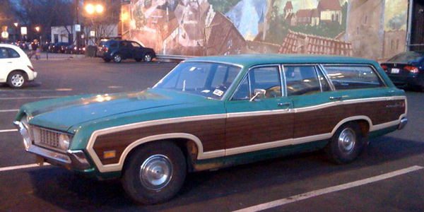 seafoam car with wood paneling
